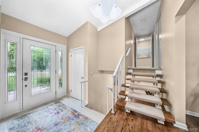 Light Filled Front Foyer and Floating Staircase | Image 4