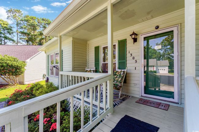 View of front of home with covered porch and a front yard | Image 16