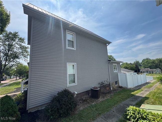 View of property exterior with a central AC unit | Image 29