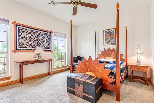 Carpeted bedroom featuring baseboards and ceiling fan | Image 23