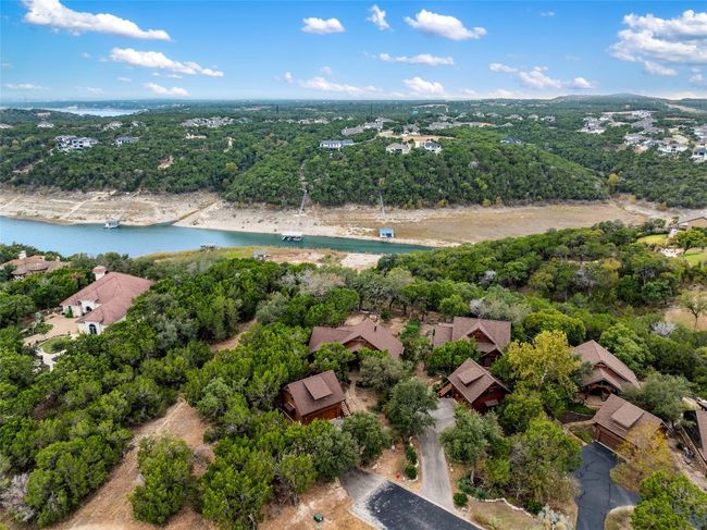Aerial view showcasing the home nestled in lush greenery at the end of the cul-de-sac. | Image 34
