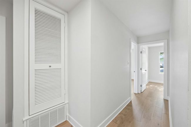 Hall featuring light wood-type flooring and baseboards | Image 20