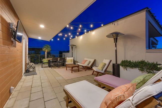 Patio at night featuring an outdoor living space | Image 34