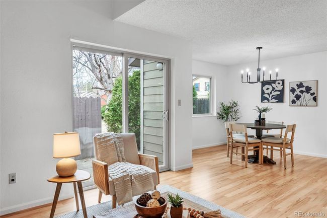 Open concept living with easy indoor-outdoor access through the sliding glass door to the back patio | Image 9