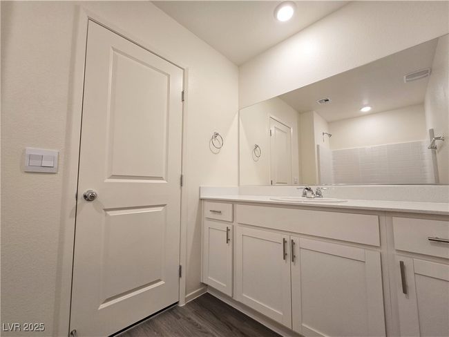 Bathroom featuring vanity, wood finished floors, and recessed lighting | Image 25