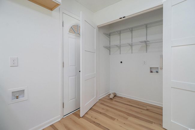Laundry with hookup for an electric dryer and washer. Conveniently located off the kitchen near the carport entrance for easy, messy drop offs! | Image 17