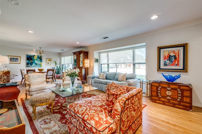 Living room with crown molding and light hardwood / wood-style floors | Image 4