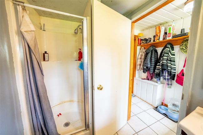 Full bath featuring a shower stall and tile patterned flooring | Image 14