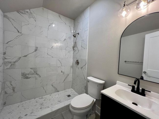 Full bathroom featuring vanity and a tile shower | Image 20