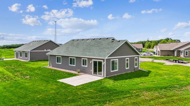Backyard features a concrete patio off of the dining room. | Image 27
