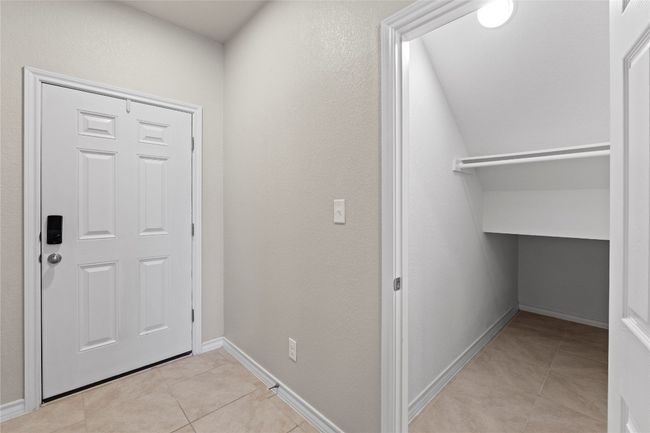 Foyer with baseboards and light tile patterned floors | Image 12