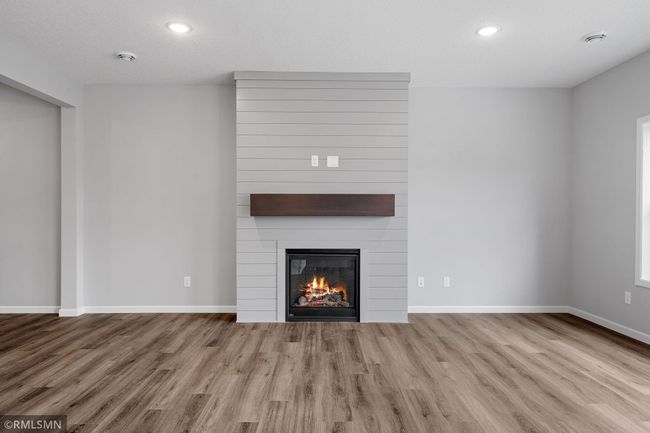 (Photo of previously finished home) Charming fireplace, perfect for hosting gatherings and keeping cozy during the chilly winter months. | Image 8