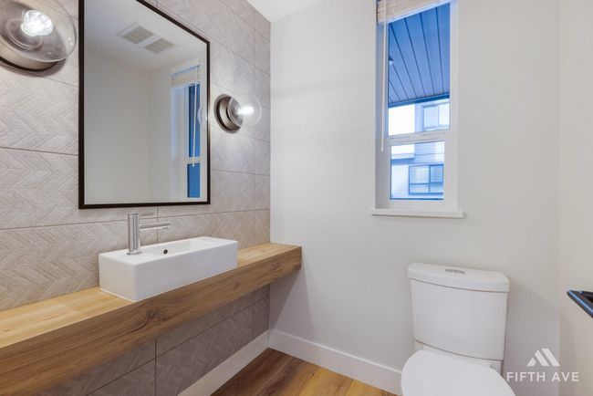 Half bath with baseboards and wood finished floors | Image 35