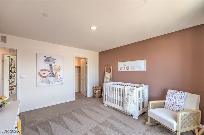 Bedroom featuring carpet, baseboards, and a spacious closet. Photo is representational only; actual home finishes may vary. | Image 33
