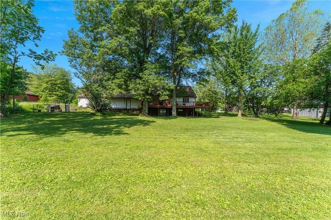 View of green lawn with a deck | Image 40