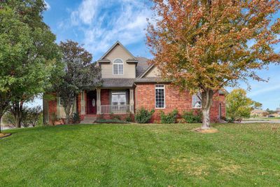 View of front of house featuring a front yard and covered porch | Image 1