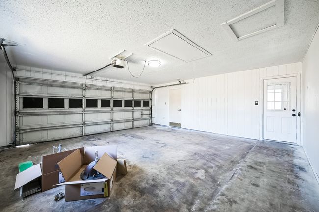 Garage with a garage door opener | Image 30