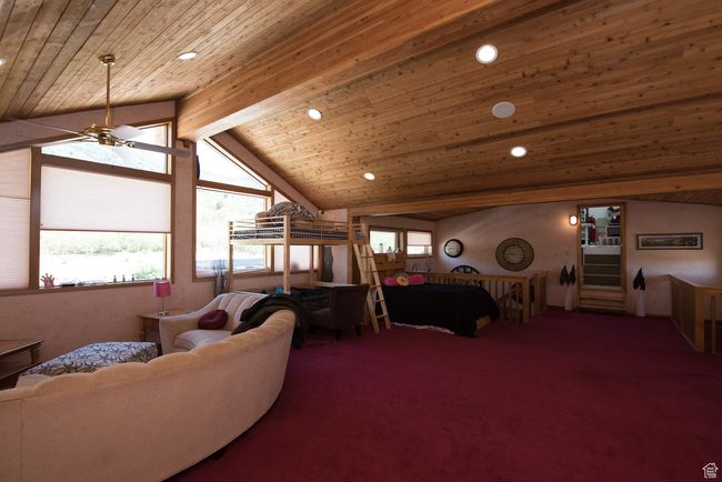 Living area featuring wood ceiling, carpet floors, recessed lighting, and ceiling fan | Image 67