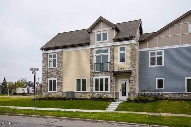 View of front of home featuring central AC unit and a front lawn | Image 4