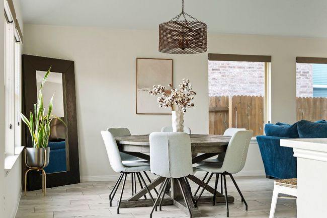 The bright and spacious dining area sits just off the kitchen. | Image 11
