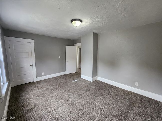 Spare room with carpet and a textured ceiling | Image 18