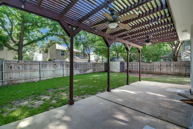 View of patio with ceiling fan and a pergola | Image 20