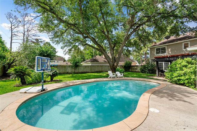 Sparkling pool is a crown jewel of the yard! | Image 33