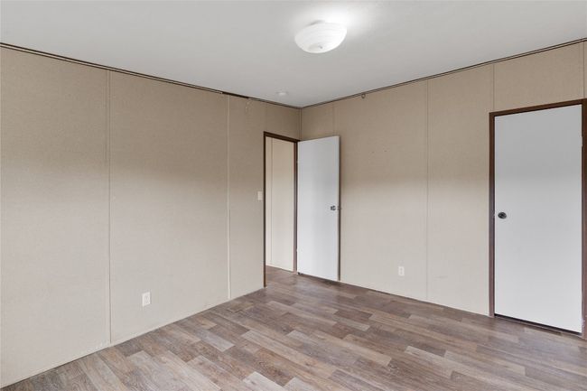 Unfurnished bedroom featuring light wood-style flooring | Image 29