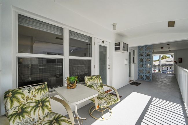 This is Your Oversized Balcony Perfect for Relaxing or Entertaining! All Impact Windows & Both Doors also have Blinds & Retractable Screen Doors, Furnished & Ready for you to Enjoy the Fresh South Florida Air & Lifestyle! | Image 24