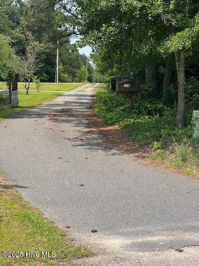 Entrance to current property where houses are located. | Image 12