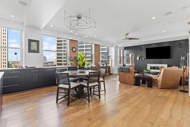 Dining area with ceiling fan, light wood-style flooring, and recessed lighting | Image 10