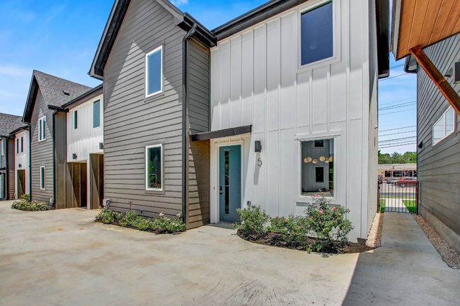 Multi unit property with board and batten siding and a patio | Image 27