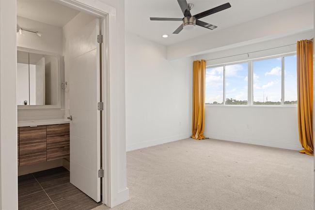 Unfurnished primary bedroom featuring recessed lighting, carpet floors, and ceiling fan | Image 17