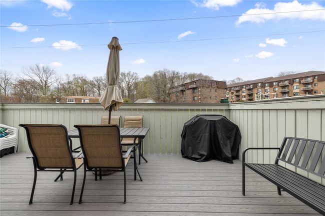 Deck featuring outdoor dining space and area for grilling | Image 42