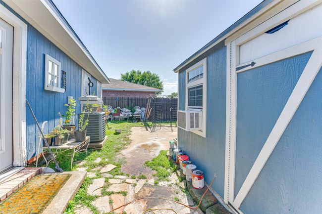 View of yard featuring fence and cooling unit | Image 20