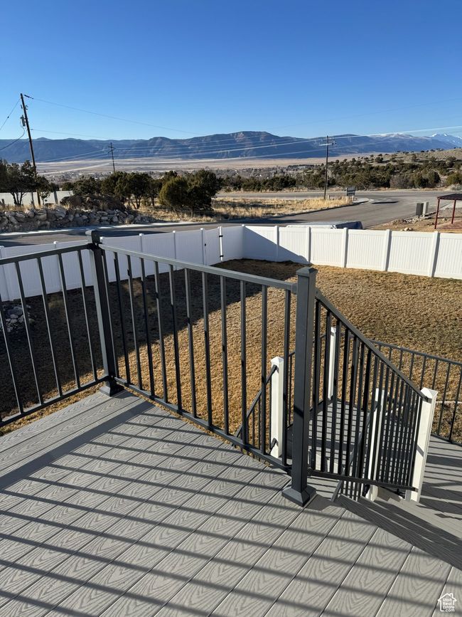 Wooden terrace with fence and a mountain view | Image 7