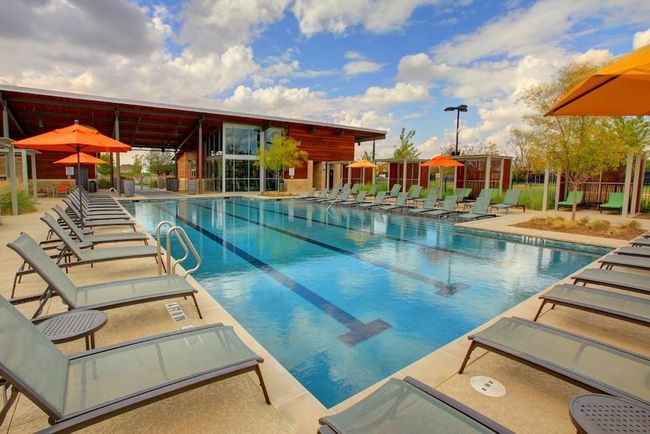 View of swimming pool with a patio | Image 33