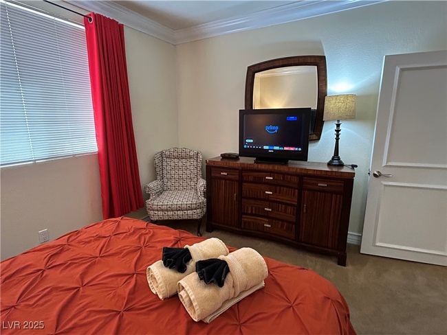 Carpeted bedroom featuring ornamental molding | Image 35