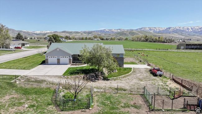 View of front of property with a view of rural / pastoral area, driveway, an attached garage, and a mountain view | Image 4