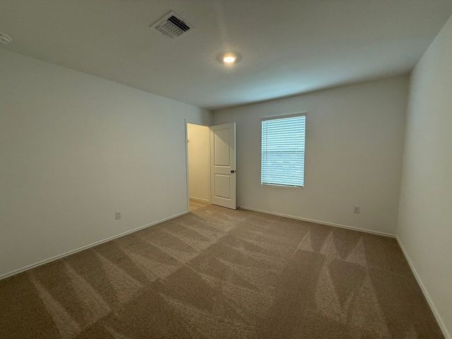Spare room with carpet floors and baseboards | Image 13