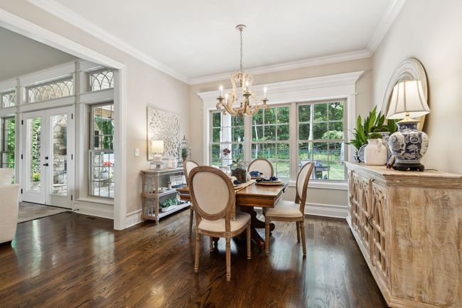 The Breakfast nook! Every meal is a delight in this lovely niche' while you watch the deer, birds and the squirrels play in the woods. Or if you prefer, you have easy views of the TV while you dine. | Image 20