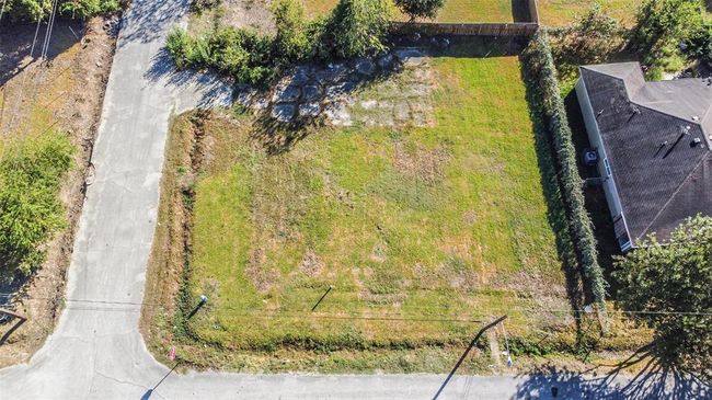 Front aerial view of corner lots 10 and 9. Lots are ripe for building single family or townhomes. Other developed townhomes on the same street. | Image 4