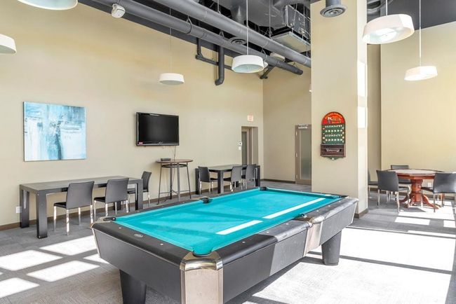 Game room with a towering ceiling, billiards, and carpet floors | Image 28