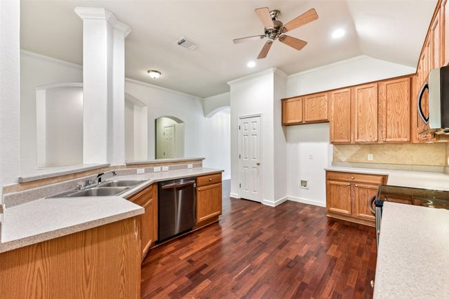 Large kitchen with ceiling fan, pantry and tons of workspace and cabinets | Image 19