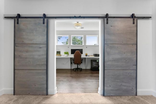 Off the upstairs living area is a bonus space currently being used as an office. | Image 32