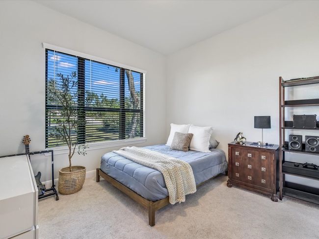 Bedroom with carpet and baseboards | Image 30