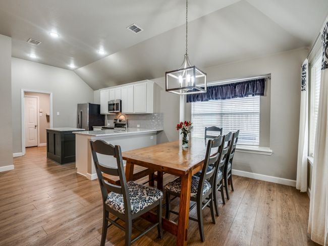 Dining room with decorative lighting | Image 7