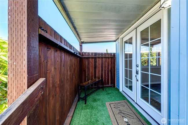Welcoming front deck with French doors. | Image 4
