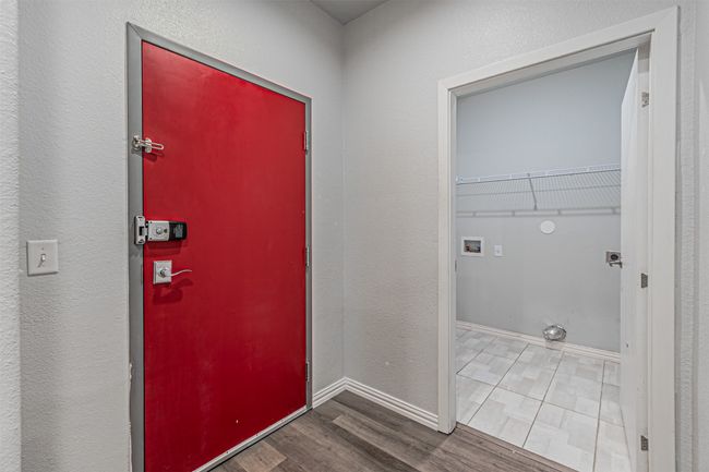Washroom featuring electric dryer hookup, wood finished floors, and washer hookup | Image 19