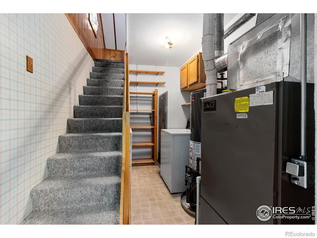 Laundry & storage room and stairs leading to very spacious loft. | Image 22